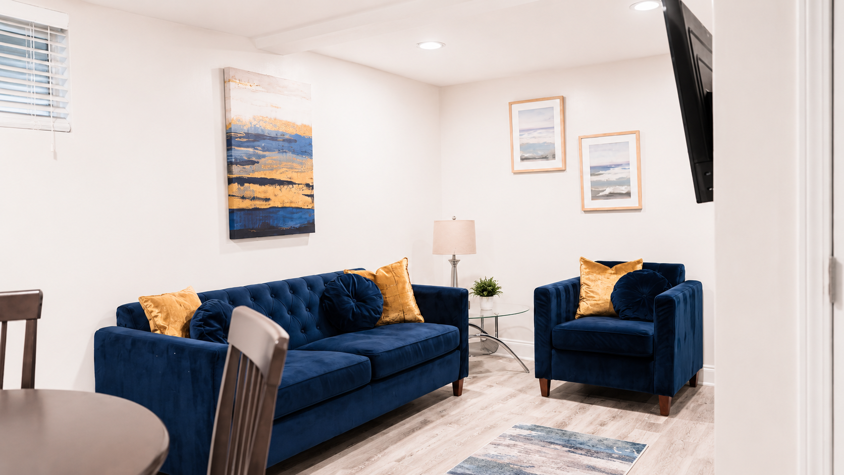 Furnished living area with blue seating